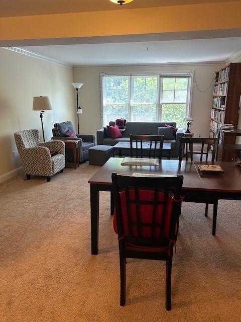 combined dining/living room with carpet flooring
