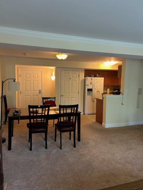 combined dining/living room with carpet flooring