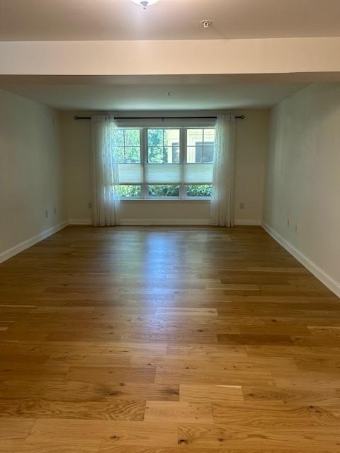 Living and dining area, open concept, hard flooring and large windows