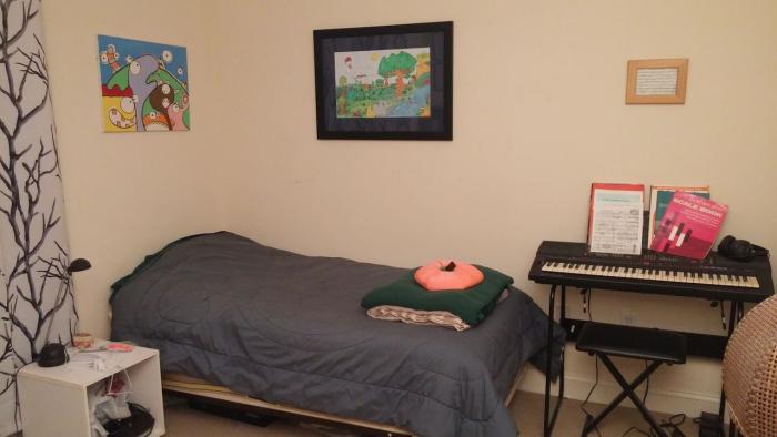 Secondary bedroom with carpeting