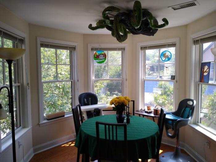 dining area with hard flooring and bay windows
