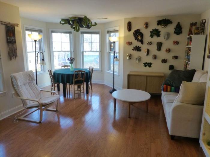 open concept living and dining area with hard flooring