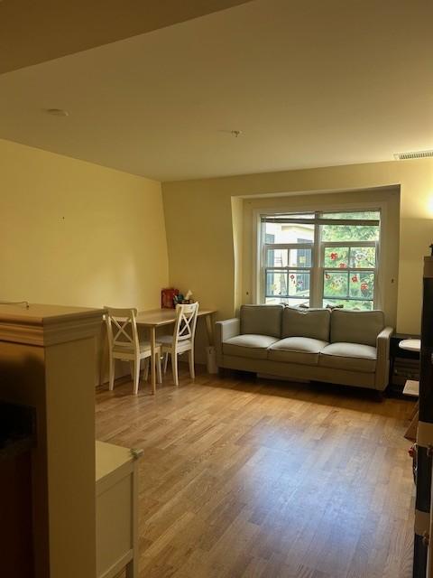 combined living and dining area with hard flooring