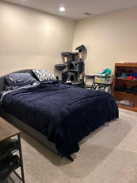 Bedroom with carpeting and overhead lighting