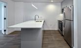 1 bedroom convertible floorplan with view of kitchen and kitchen island